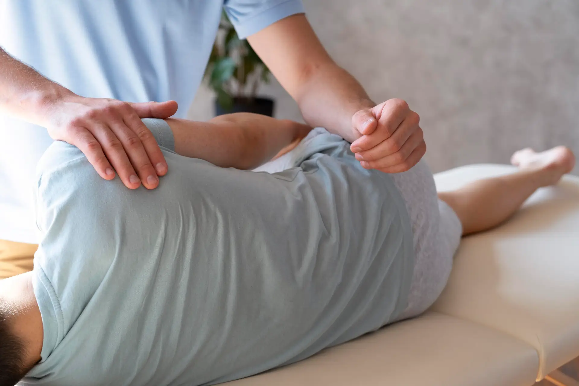 close-up-physiotherapist-helping-patient-with-pain